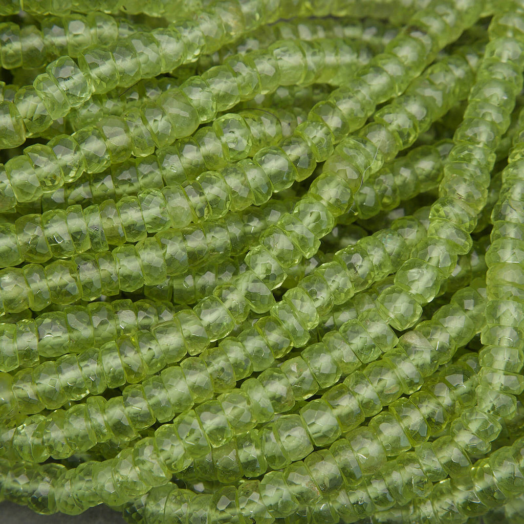 Faceted peridot rondelle beads in bright lime green tones, natural gemstone strand