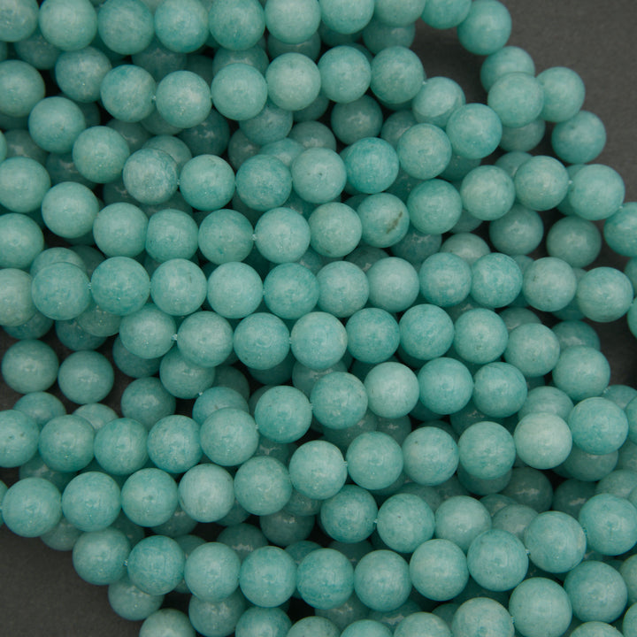 Close-up of turquoise beads on a dark background
