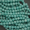 Close-up of turquoise beads on a dark background