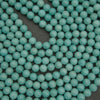 Close-up of turquoise beads on a dark background