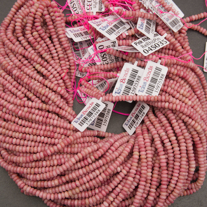 Small pink gemstone rondelle beads with natural variations