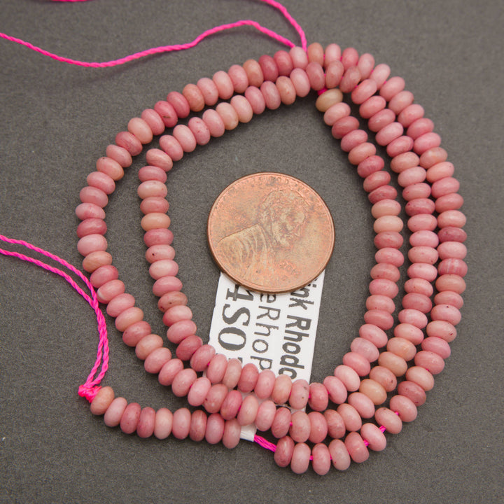 Pink stone rondelle bead strands with soft mottled coloring