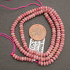 Pink stone rondelle bead strands with soft mottled coloring