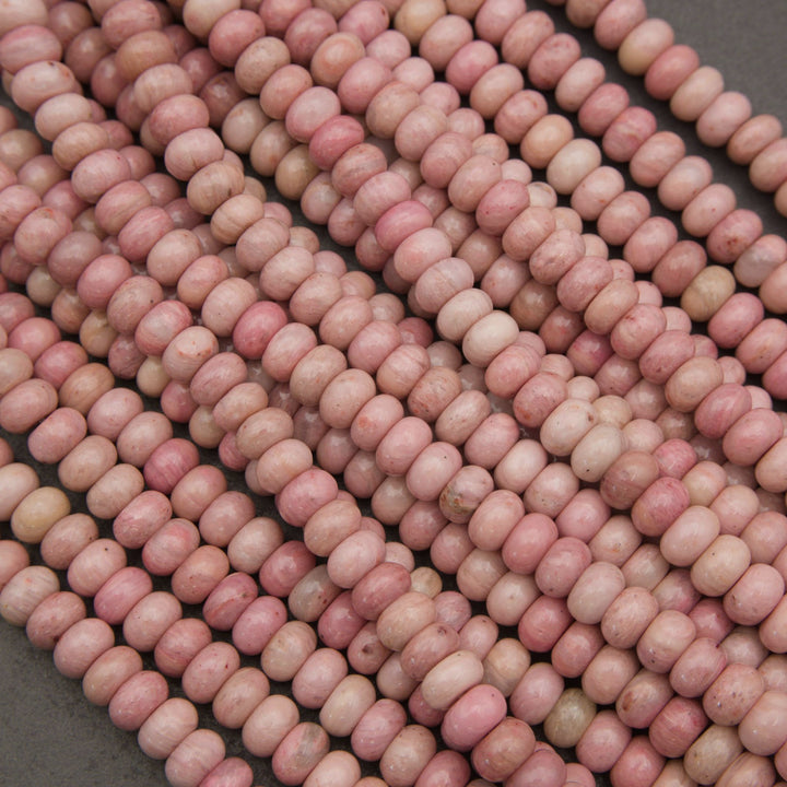 Pink rondelle rhodonite beads.