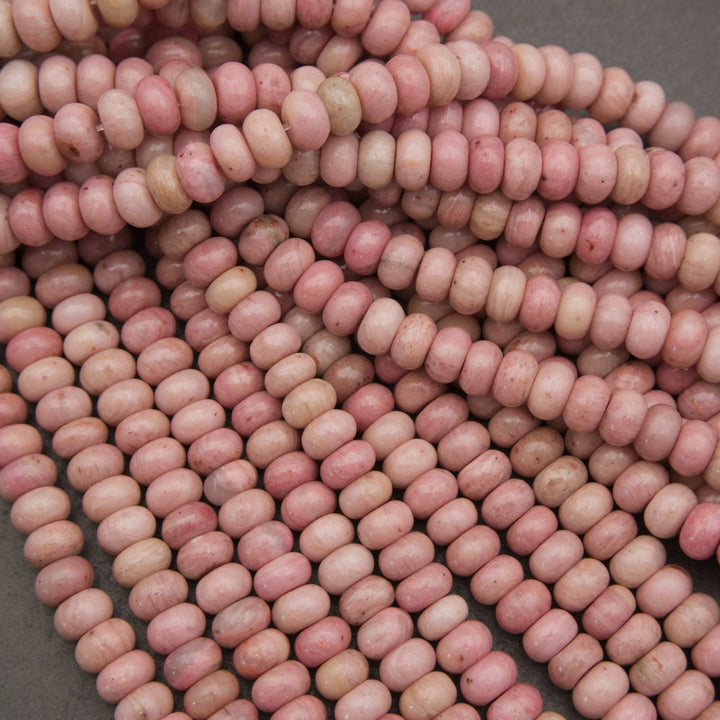 Pink rondelle rhodonite beads.
