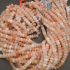 Natural stone Peach Aventurine beads with subtle translucency and polish.