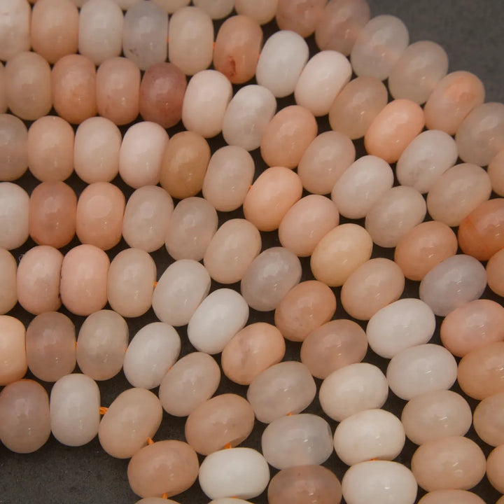 Close-up of smooth Peach Aventurine rondelle beads with soft natural coloring.