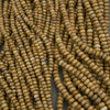 Close-up of brown beads on a dark background