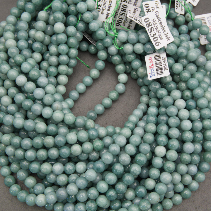 Light green Guatemalan jade gemstone beads with beautiful seafoam coloring and natural marbling for handmade bracelets and necklaces.