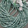 Light green Guatemalan jade gemstone beads with beautiful seafoam coloring and natural marbling for handmade bracelets and necklaces.