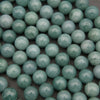 Strands of natural Guatemalan jade beads featuring soft pastel green tones and delicate mineral variations.