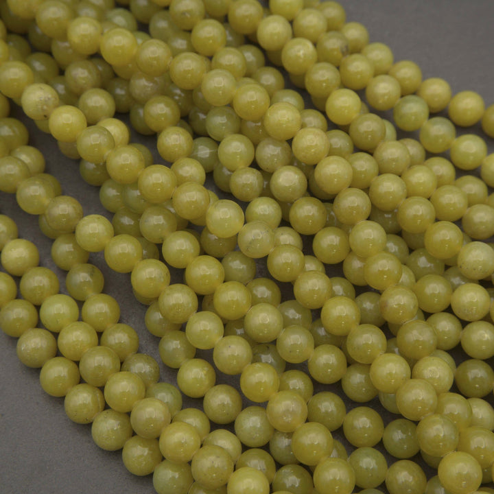 Olive jade polished round beads.
