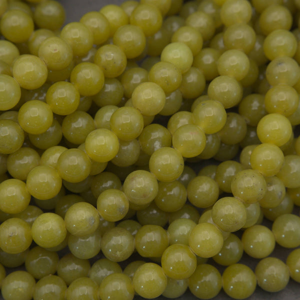 Olive jade polished round beads.