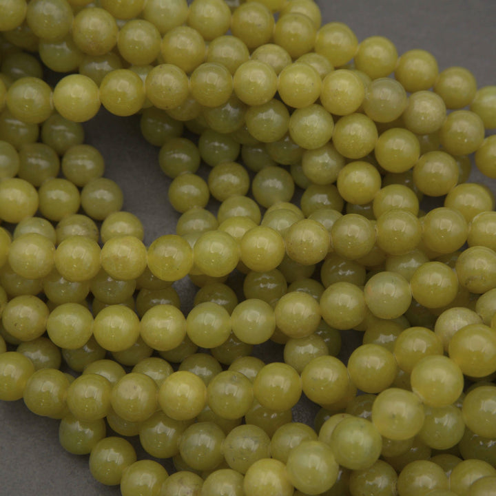 Olive jade polished round beads.