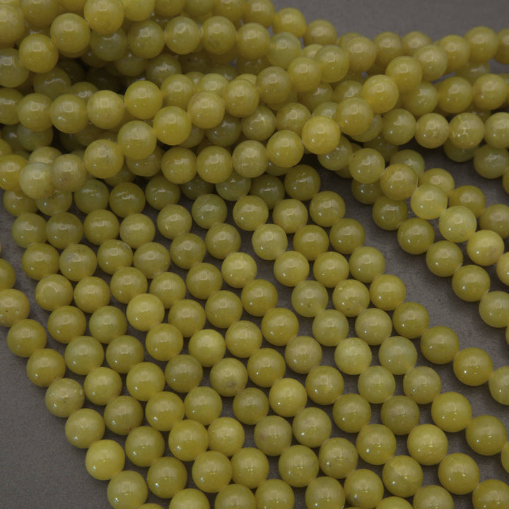 Olive jade polished round beads.