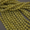 Olive jade polished round beads.