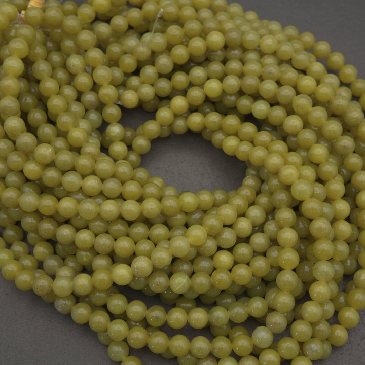 Olive jade polished round beads.