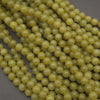 Olive jade polished round beads.