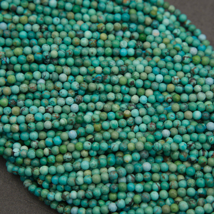 Strands of turquoise round beads displaying a colorful mix of sky blue, mint green, and aqua tones.