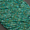 Strands of turquoise round beads displaying a colorful mix of sky blue, mint green, and aqua tones.
