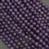 Close-up of purple beads on a dark background