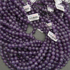 Purple beads with barcodes on a gray background