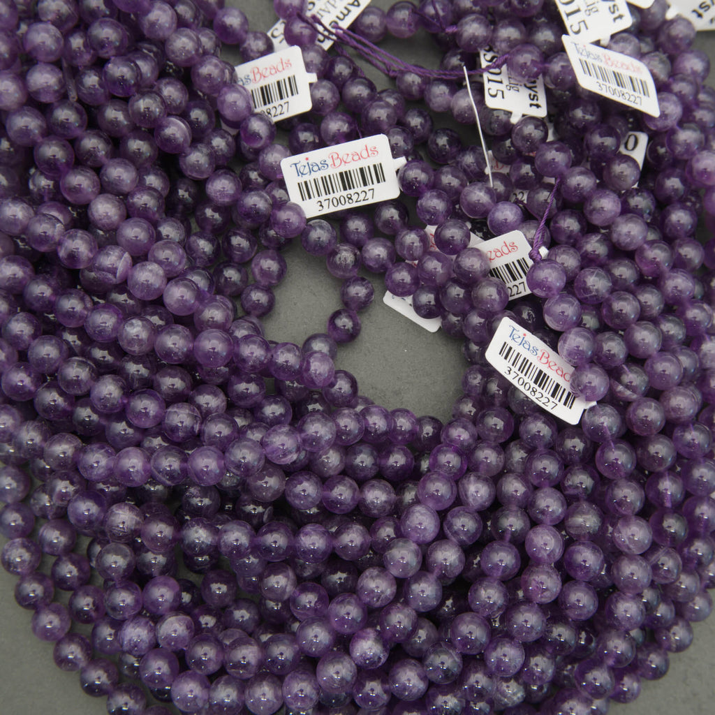 Purple beads with barcodes on a gray background