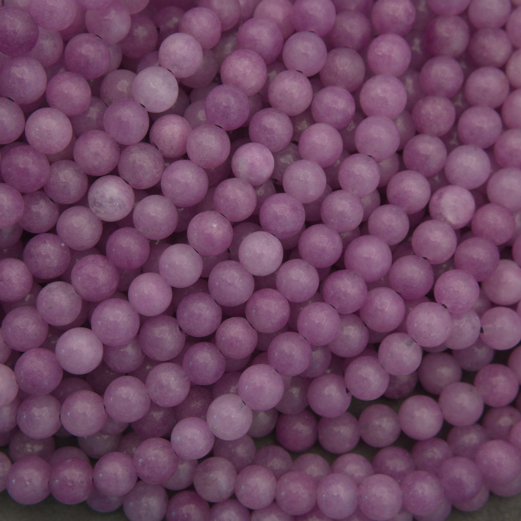 Close-up of pink pearls on a gray background