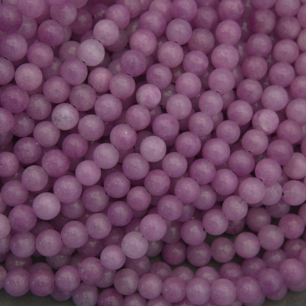Close-up of pink pearls on a gray background