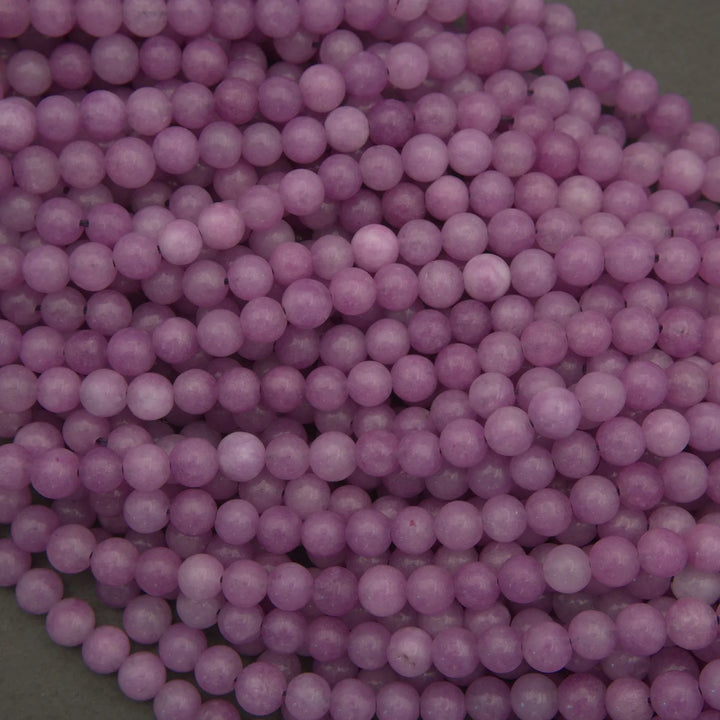 Close-up of purple beads on a green background