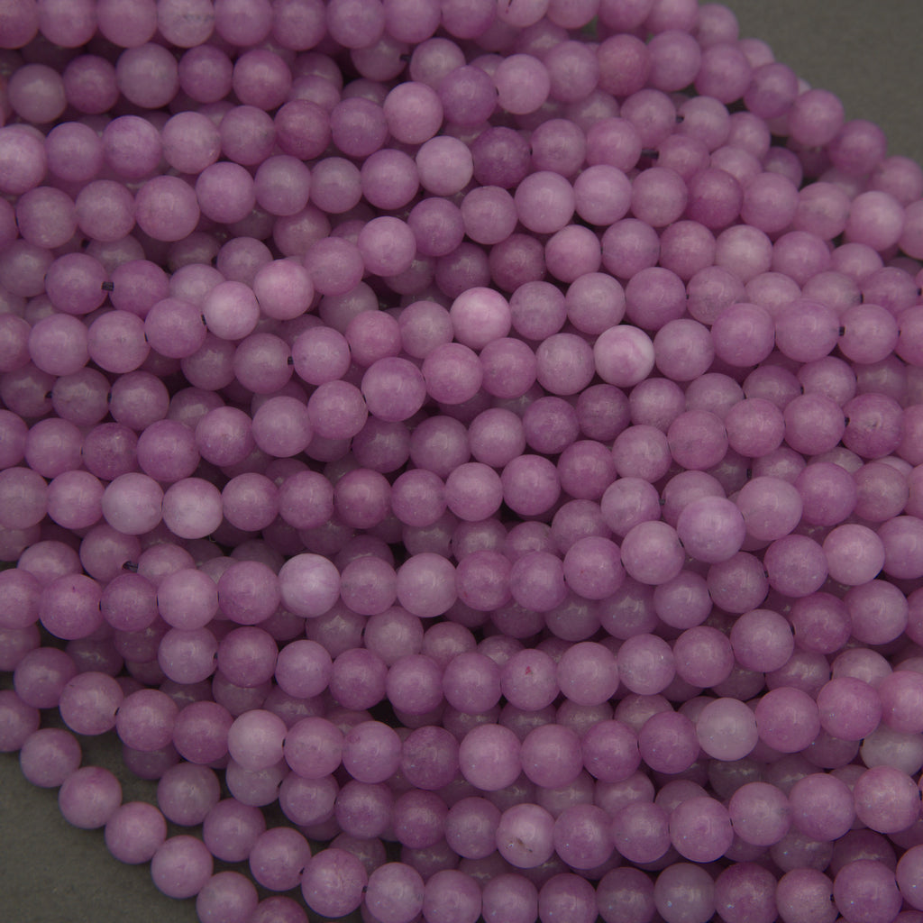 Close-up of purple beads on a green background
