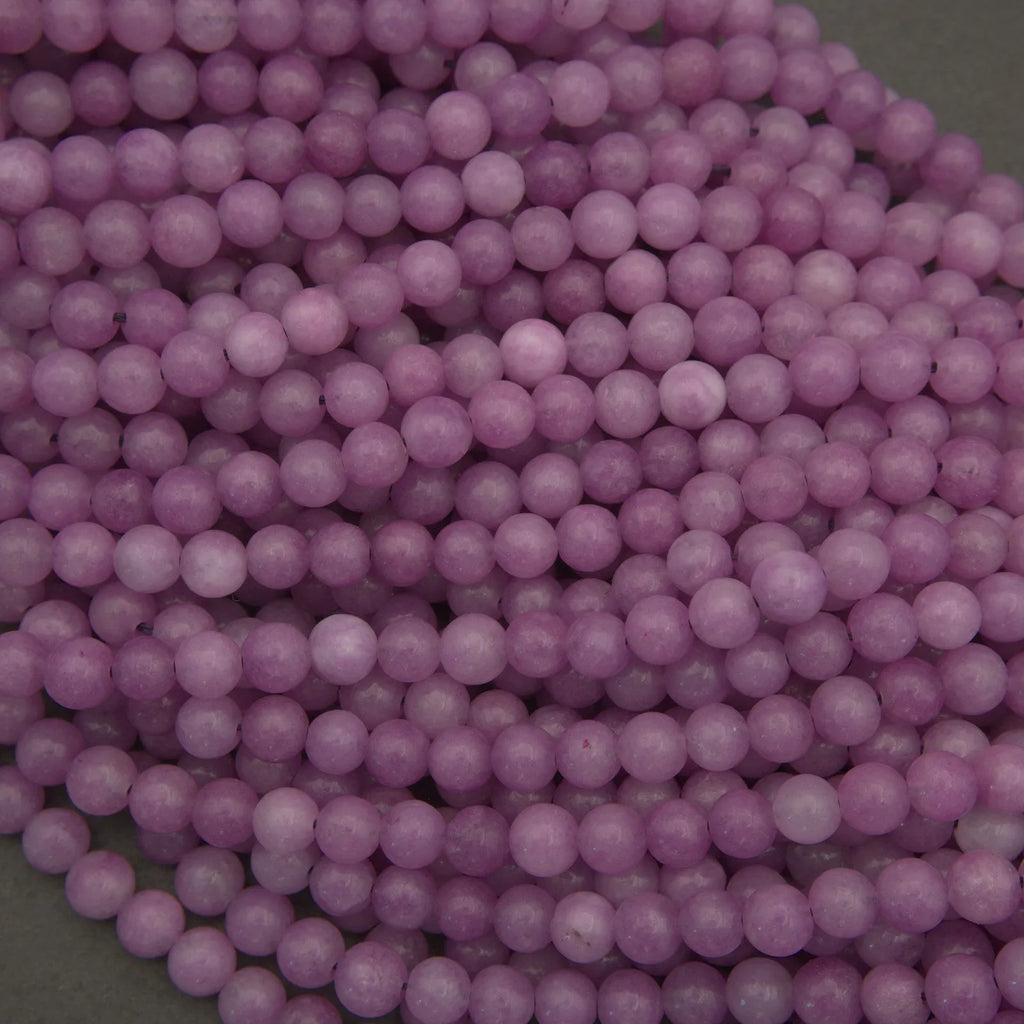 Close-up of purple beads on a green background