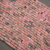 Strands of rectangular rhodonite beads with varied rosy-pink tones and earthy brown-gray patterns.