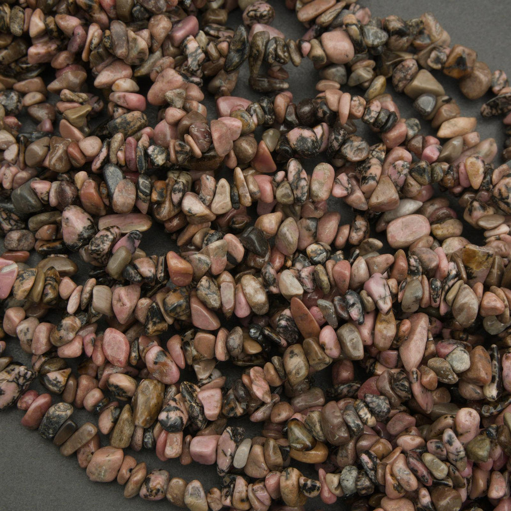 Close-up of a string of multicolored stones on a dark background