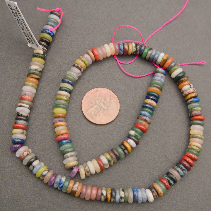 Mixed natural stone rondelle beads with varied colors and markings