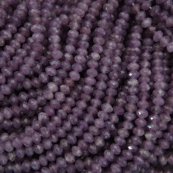 Close-up of purple beads with a textured surface