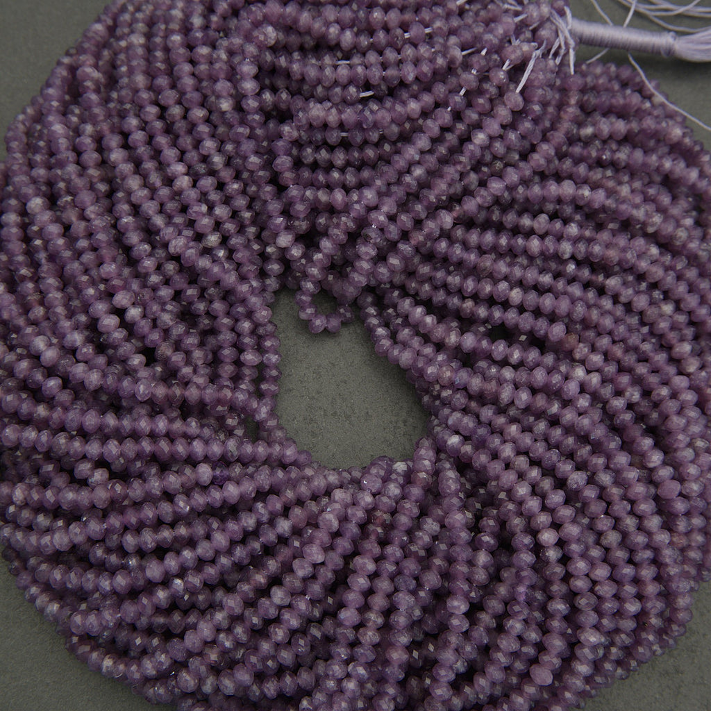 Close-up of a purple scrunchie on a dark background