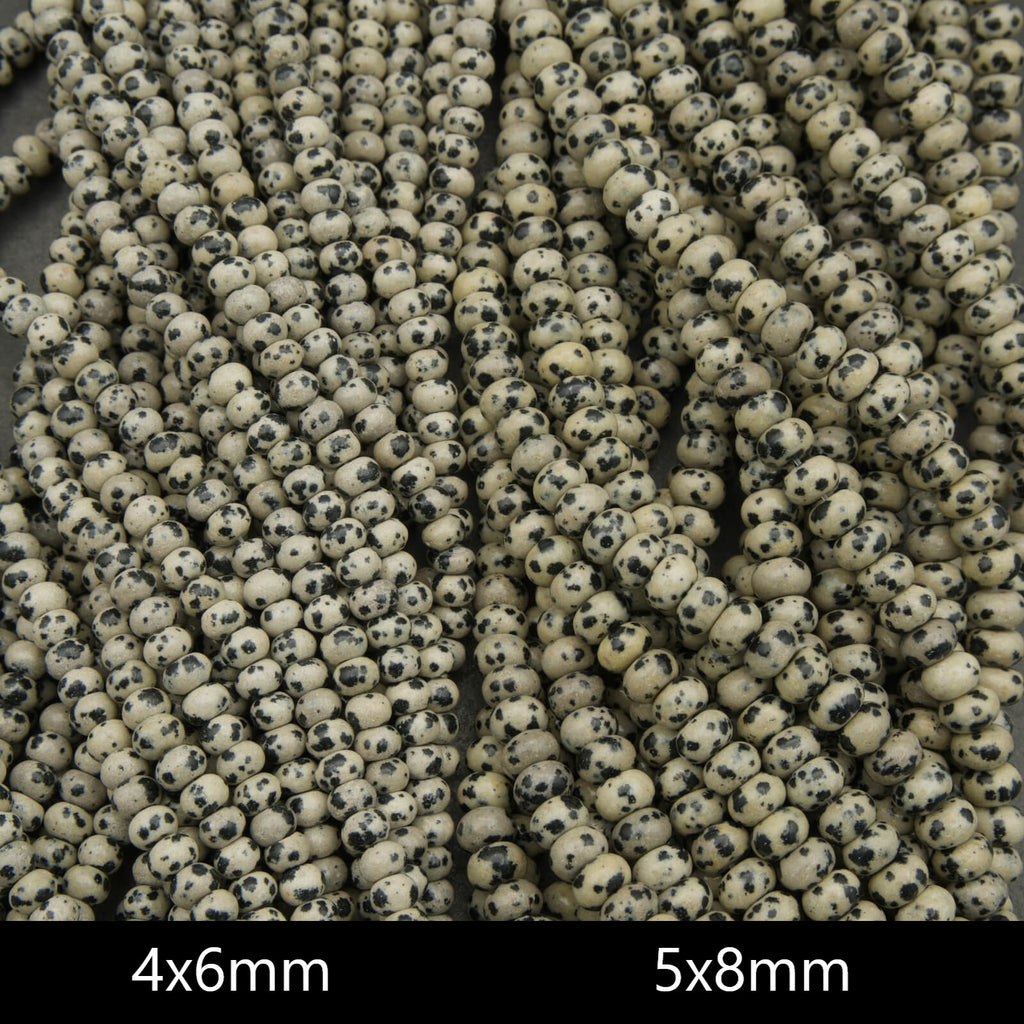 Close-up of small beads with size specifications 4x6mm and 5x8mm.