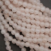 Close-up of pink pearls on a dark background