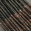 Close-up of black and brown beads arranged in a pattern.
