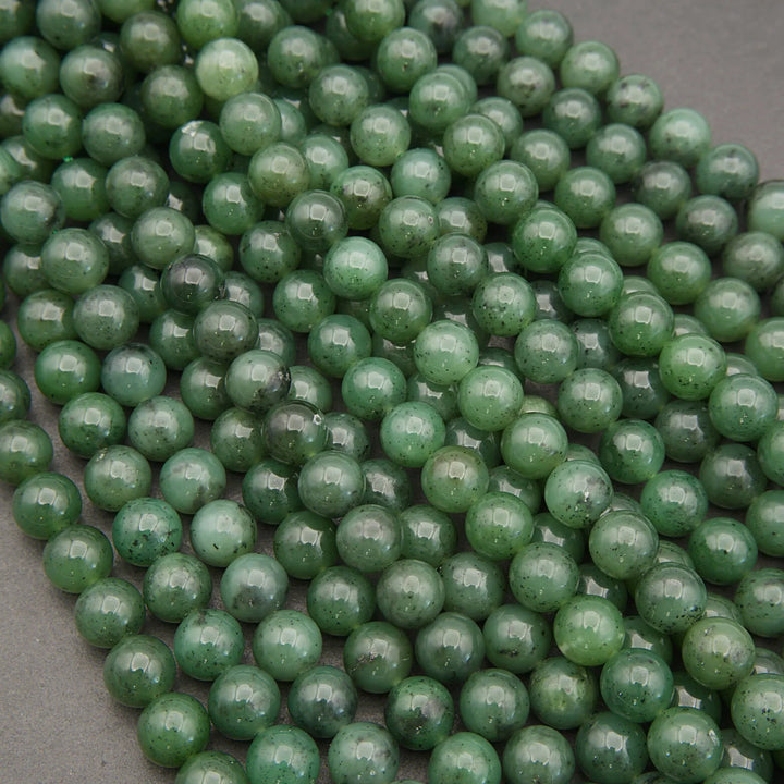 Close-up of green beads on a gray surface