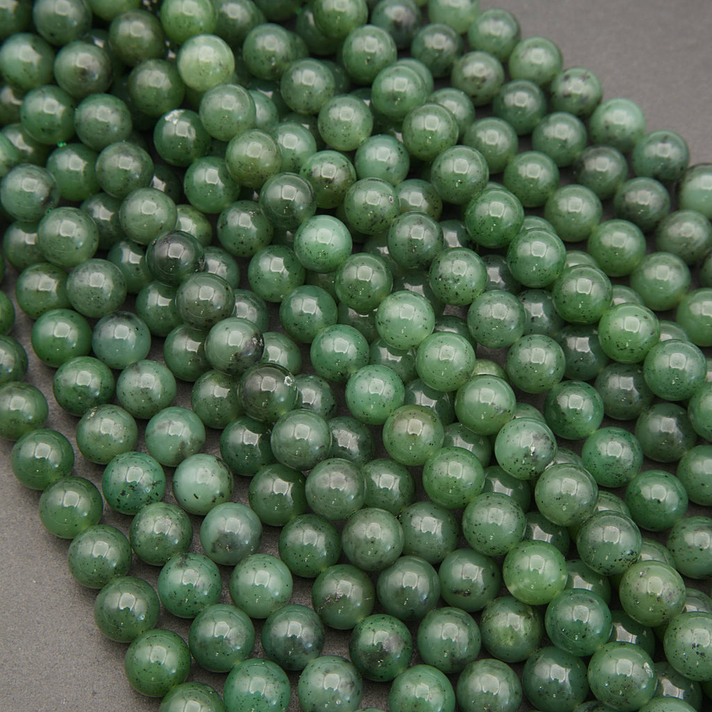 Close-up of green beads on a gray surface