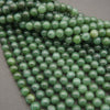 Close-up of green beads on a gray background