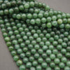 Close-up of green beads on a gray background