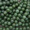 Close-up of green beads on a gray background