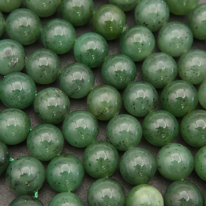 Close-up of green beads on a dark background