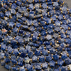 Strands of faceted snowflake sodalite star beads in royal and denim blue with white and peach patches