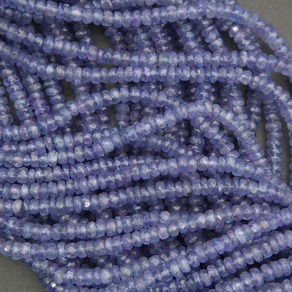 Natural tanzanite beads with translucent violet blue color, faceted rondelle shape