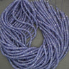 Faceted tanzanite rondelle beads with delicate violet blue color variation