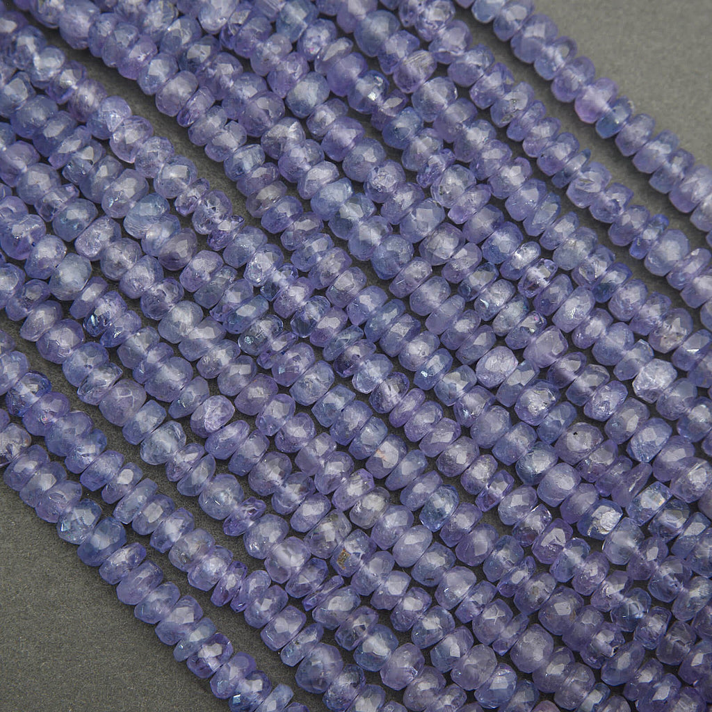 Tanzanite beads close-up showing natural texture, translucency, and light reflection